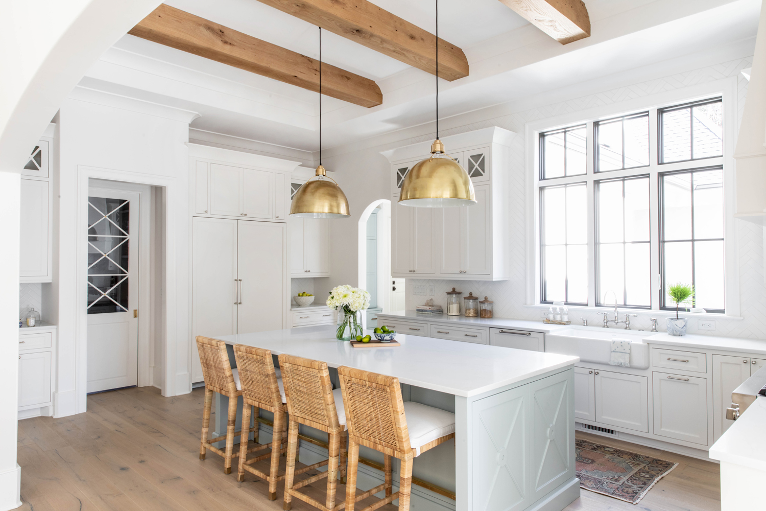 Bright custom kitchen with a generous stone island